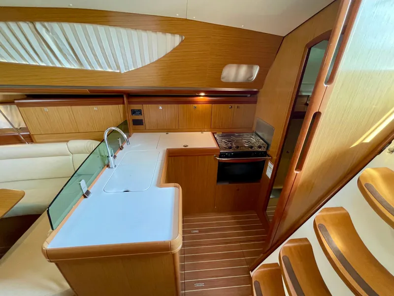 Slide: The Image of 2008 Jeanneau Sun Odyssey 42 DS interior with modern kitchen and wooden finish. - 15