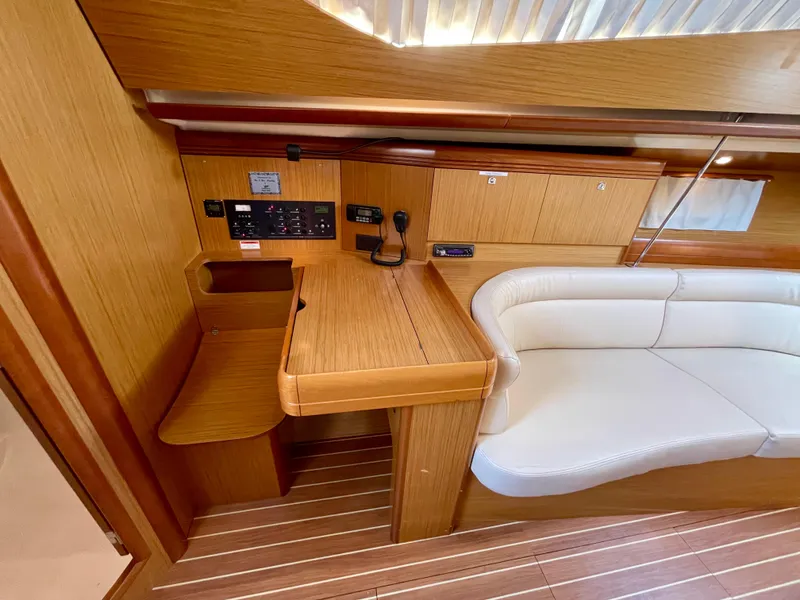 Slide: The Image of Interior of 2008 Jeanneau Sun Odyssey 42 DS yacht with wood finish and white seating. - 16