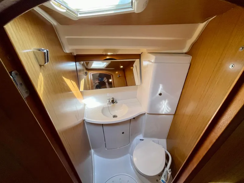 Slide: The Image of 2008 Jeanneau Sun Odyssey 42 DS bathroom with modern fixtures and wood accents. - 19
