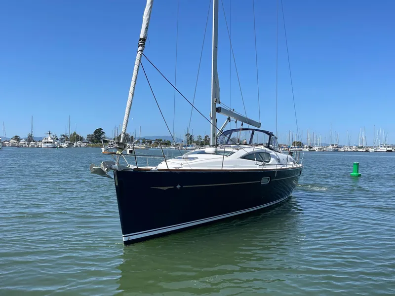 Slide: The Image of 2008 Jeanneau Sun Odyssey 42 DS sailboat on calm water, clear sky background. - 2
