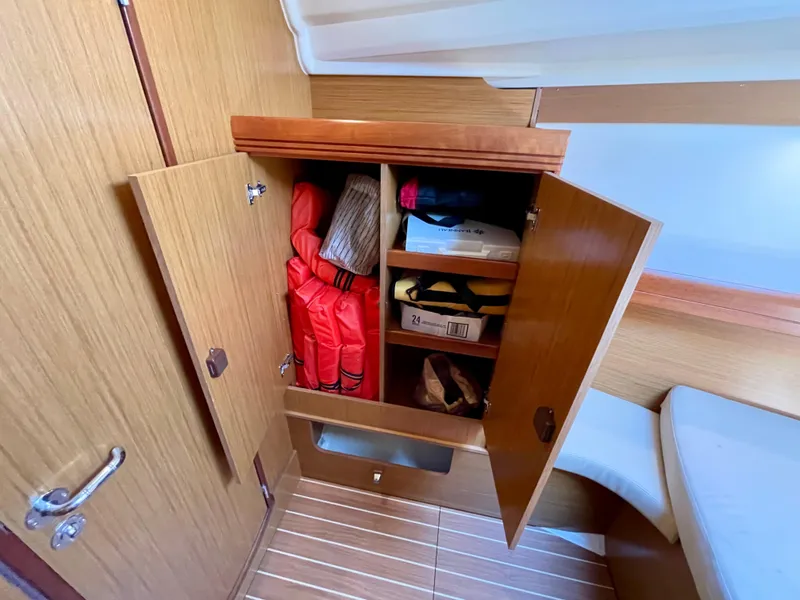 Slide: The Image of Cabin storage in 2008 Jeanneau Sun Odyssey 42 DS yacht with life jackets and supplies. - 20