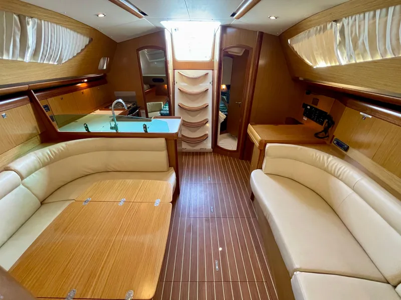 Slide: The Image of Interior of 2008 Jeanneau Sun Odyssey 42 DS yacht with elegant wood finish and seating. - 21