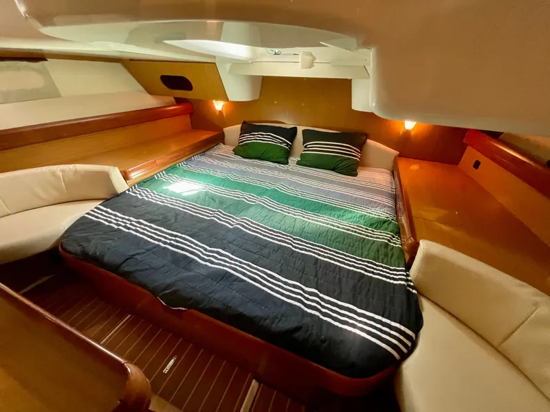 Slide: The Image of Luxurious cabin interior of 2008 Jeanneau Sun Odyssey 42 DS yacht with cozy bedding. - 22