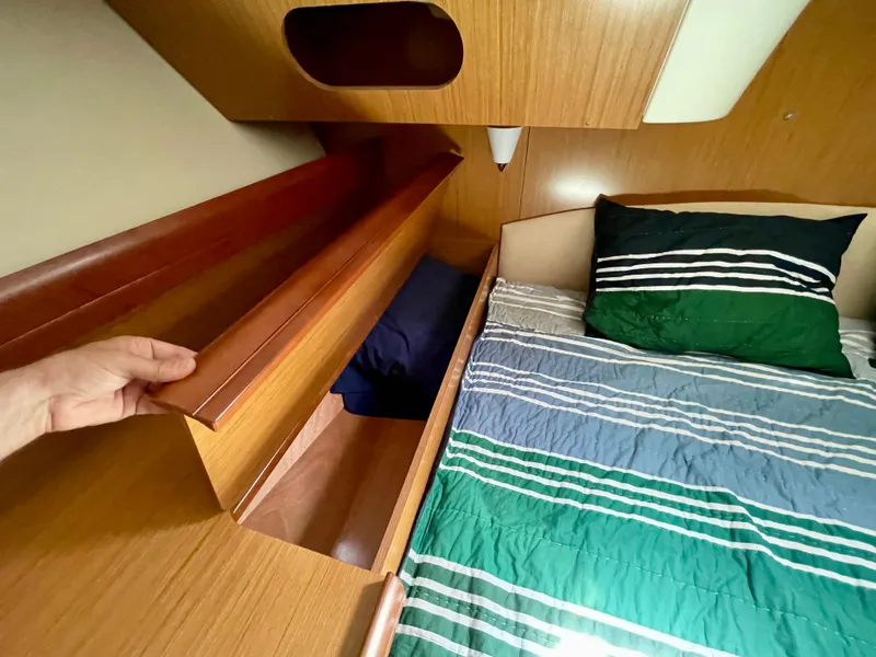 Slide: The Image of Interior cabin of 2008 Jeanneau Sun Odyssey 42 DS with bed and storage compartment. - 23