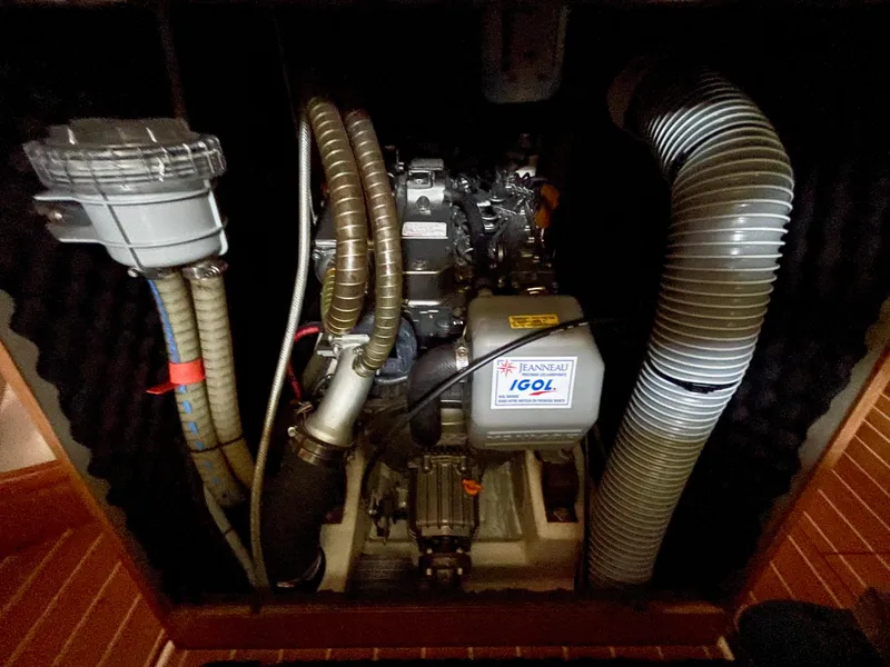 Slide: The Image of Engine compartment of 2008 Jeanneau Sun Odyssey 42 DS sailboat, featuring hoses and components. - 27