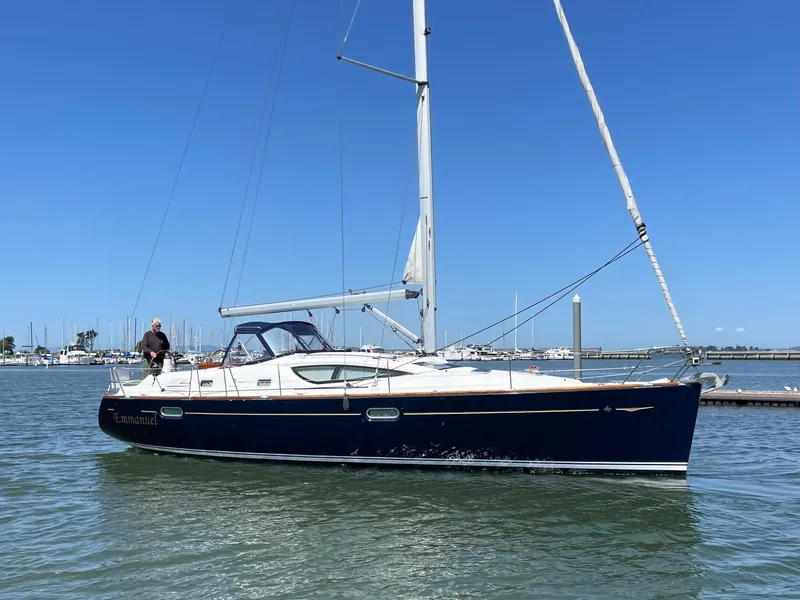 Slide: The Image of 2008 Jeanneau Sun Odyssey 42 DS sailing on calm waters under clear blue skies. - 4