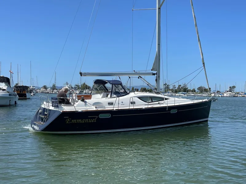 Slide: The Image of 2008 Jeanneau Sun Odyssey 42 DS sailboat on calm water, named "Emmanuel." - 5