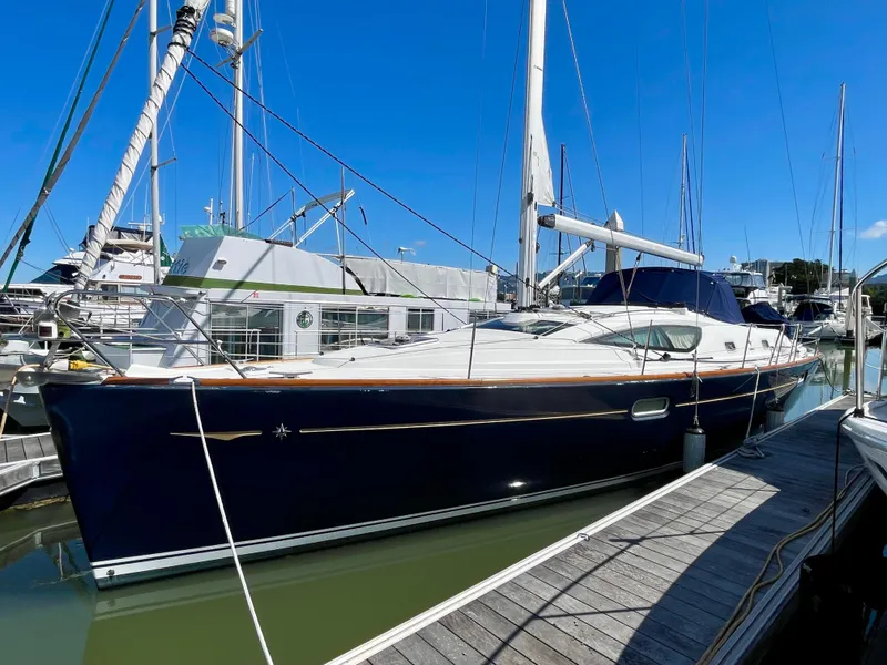 Slide: The Image of 2008 Jeanneau Sun Odyssey 42 DS sailboat docked at marina under clear blue sky. - 7