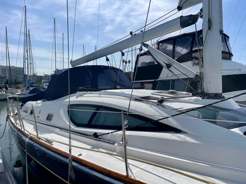 Slide: The Image of 2008 Jeanneau Sun Odyssey 42 DS sailboat docked in marina under clear sky. - 8