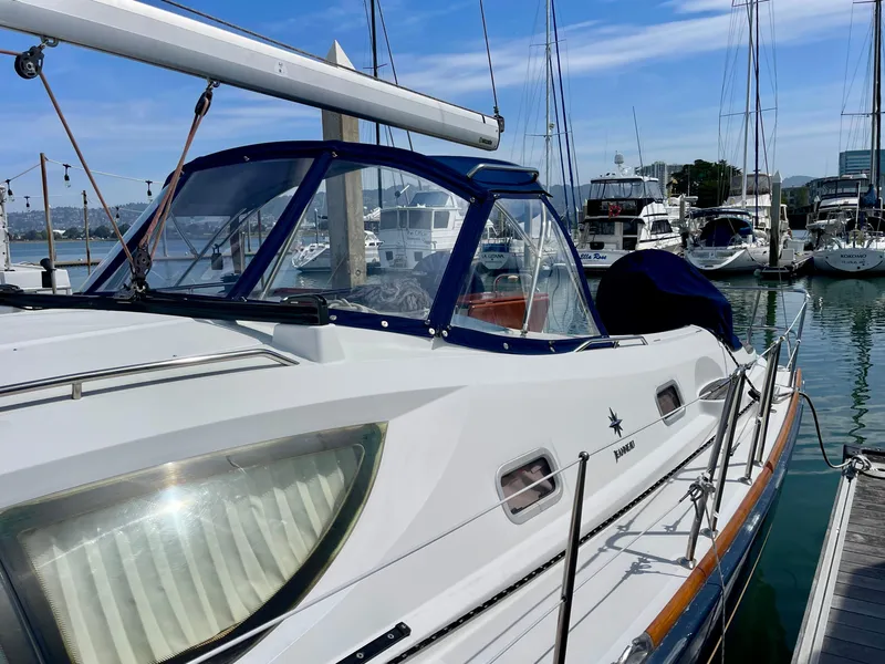 Slide: The Image of 2008 Jeanneau Sun Odyssey 42 DS sailboat docked in marina, clear blue sky. - 9