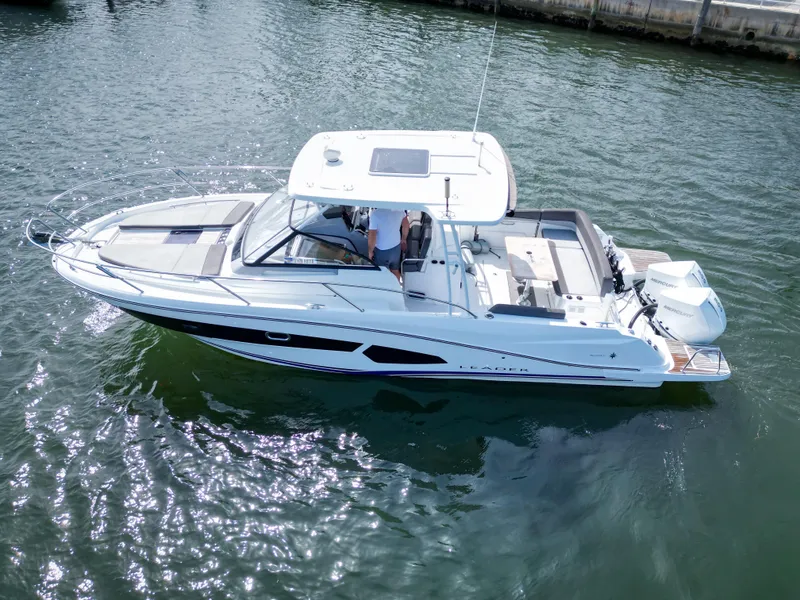 Slide: The Image of 2021 Jeanneau Leader 10.5 WA boat on water, aerial view. - 14