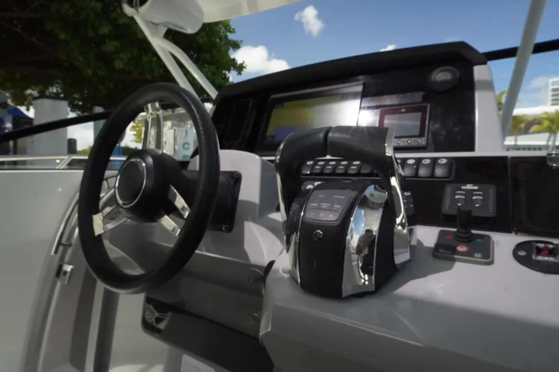 Slide: The Image of Cockpit of 2021 Jeanneau Leader 10.5 WA boat with steering wheel and controls. - 20