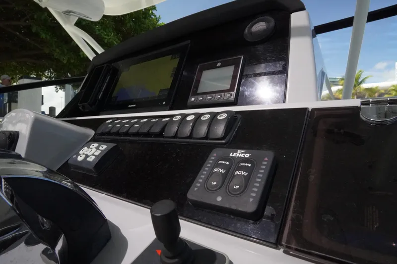 Slide: The Image of Control panel of 2021 Jeanneau Leader 10.5 WA boat with navigation and control systems. - 21