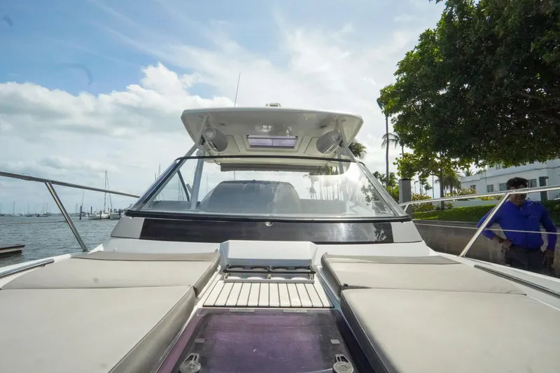 Slide: The Image of 2021 Jeanneau Leader 10.5 WA boat docked by the waterfront under a cloudy sky. - 24