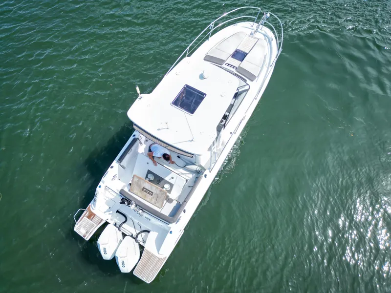 Slide: The Image of Aerial view of 2021 Jeanneau Leader 10.5 WA boat on calm water. - 3