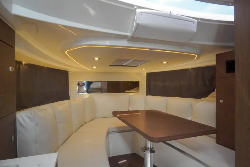 Slide: The Image of 2021 Jeanneau Leader 10.5 WA interior with elegant seating and modern design. - 37