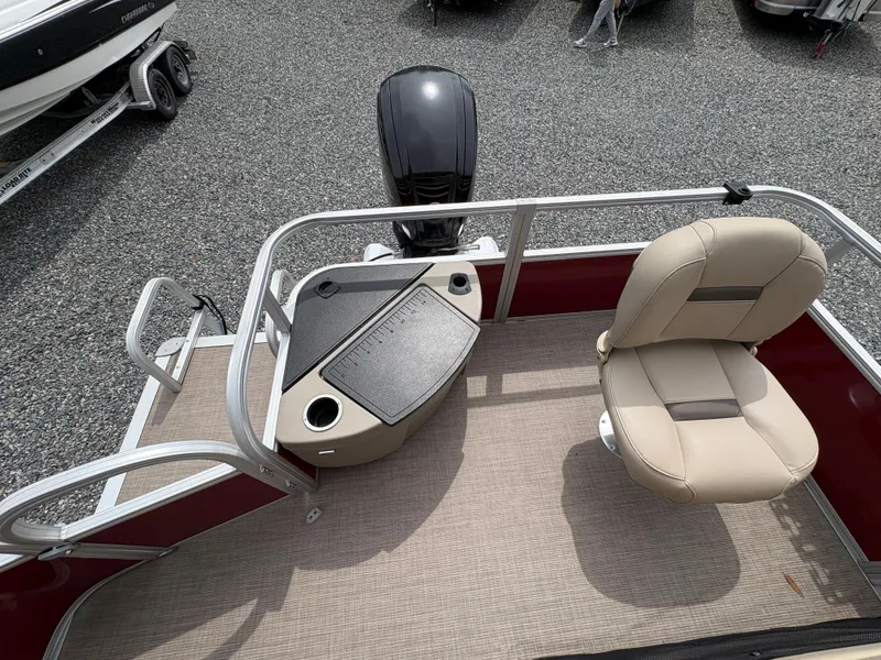 Slide: The Image of 2021 Sun Tracker Fishin' Barge 20 DLX boat deck with seating and motor. - 10