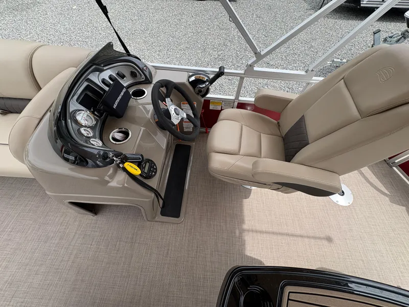 Slide: The Image of 2021 Sun Tracker Fishin' Barge 20 DLX boat interior with steering console and captain's chair. - 12