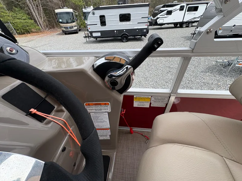 Slide: The Image of Interior of 2021 Sun Tracker Fishin' Barge 20 DLX with steering wheel and throttle control. - 14