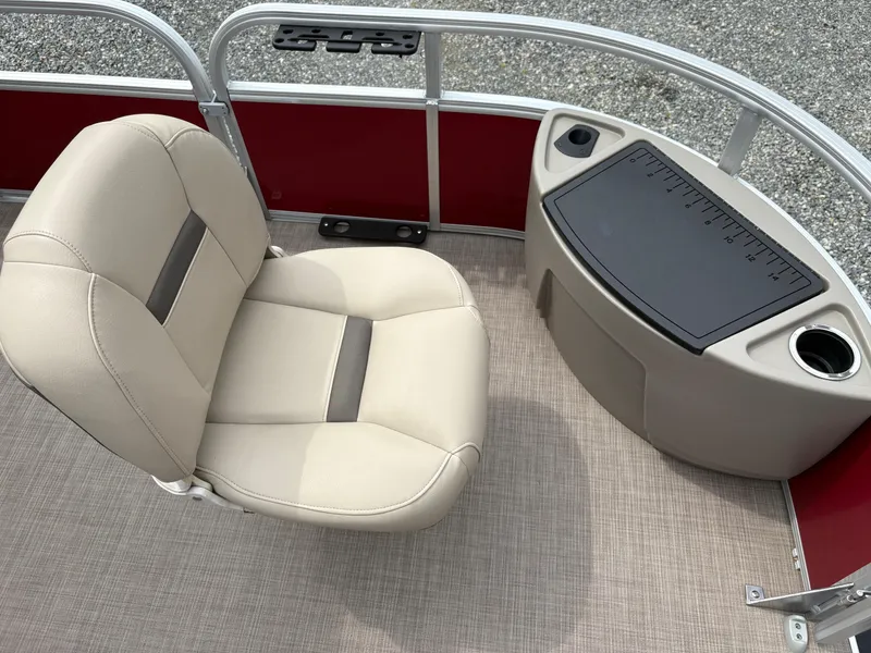 Slide: The Image of 2021 Sun Tracker Fishin' Barge 20 DLX interior with beige seat and fishing station. - 16