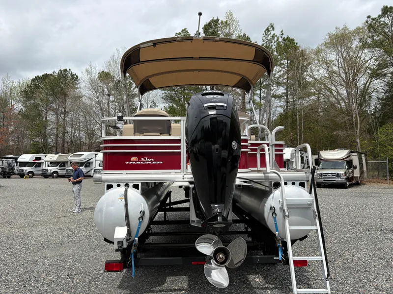 Slide: The Image of 2021 Sun Tracker Fishin' Barge 20 DLX pontoon boat with canopy and outboard motor. - 4