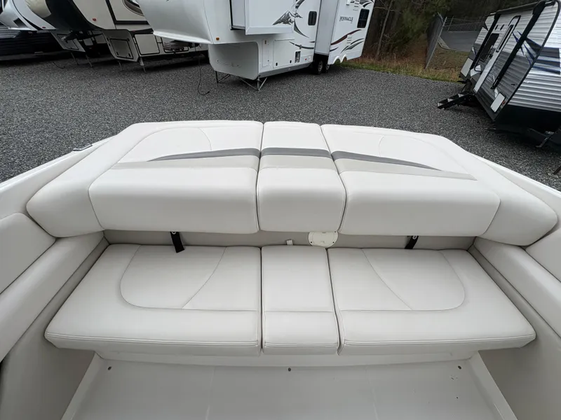 Slide: The Image of 2009 Chaparral 210 SSi boat interior with white cushioned seating. - 14