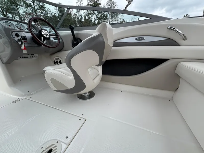 Slide: The Image of 2009 Chaparral 210 SSi boat interior with steering wheel and captain's chair. - 17
