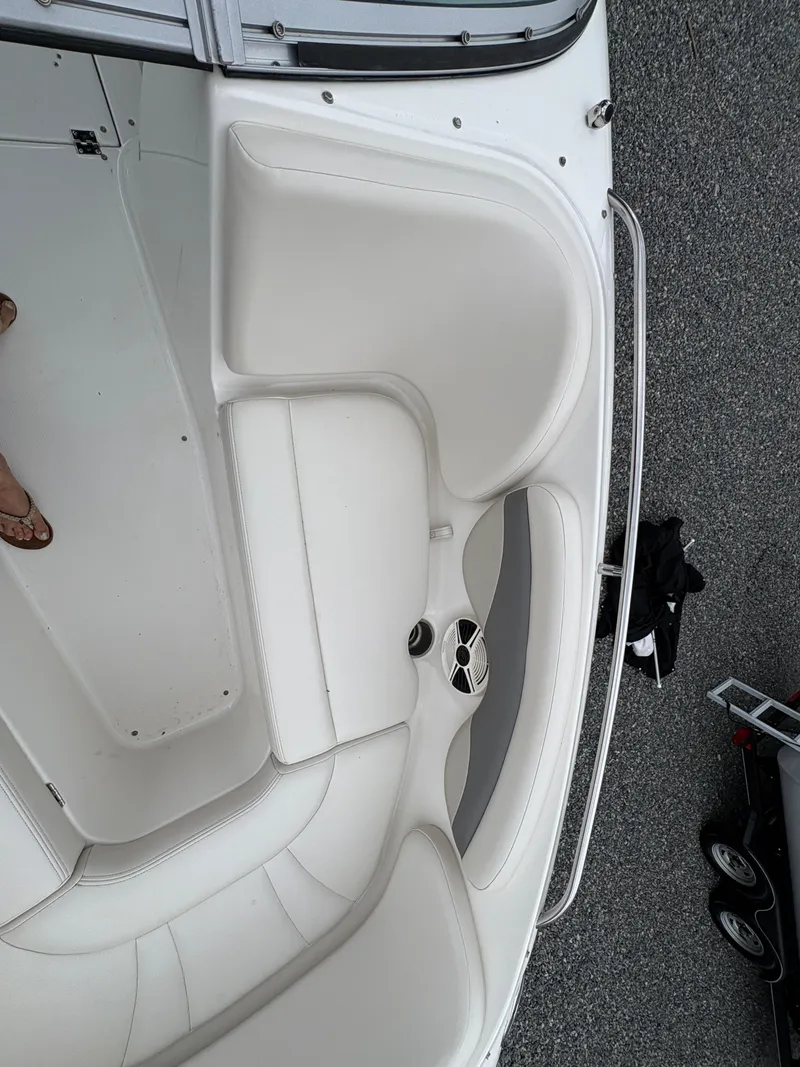Slide: The Image of 2009 Chaparral 210 SSi boat interior with white seating and stainless steel rail. - 19