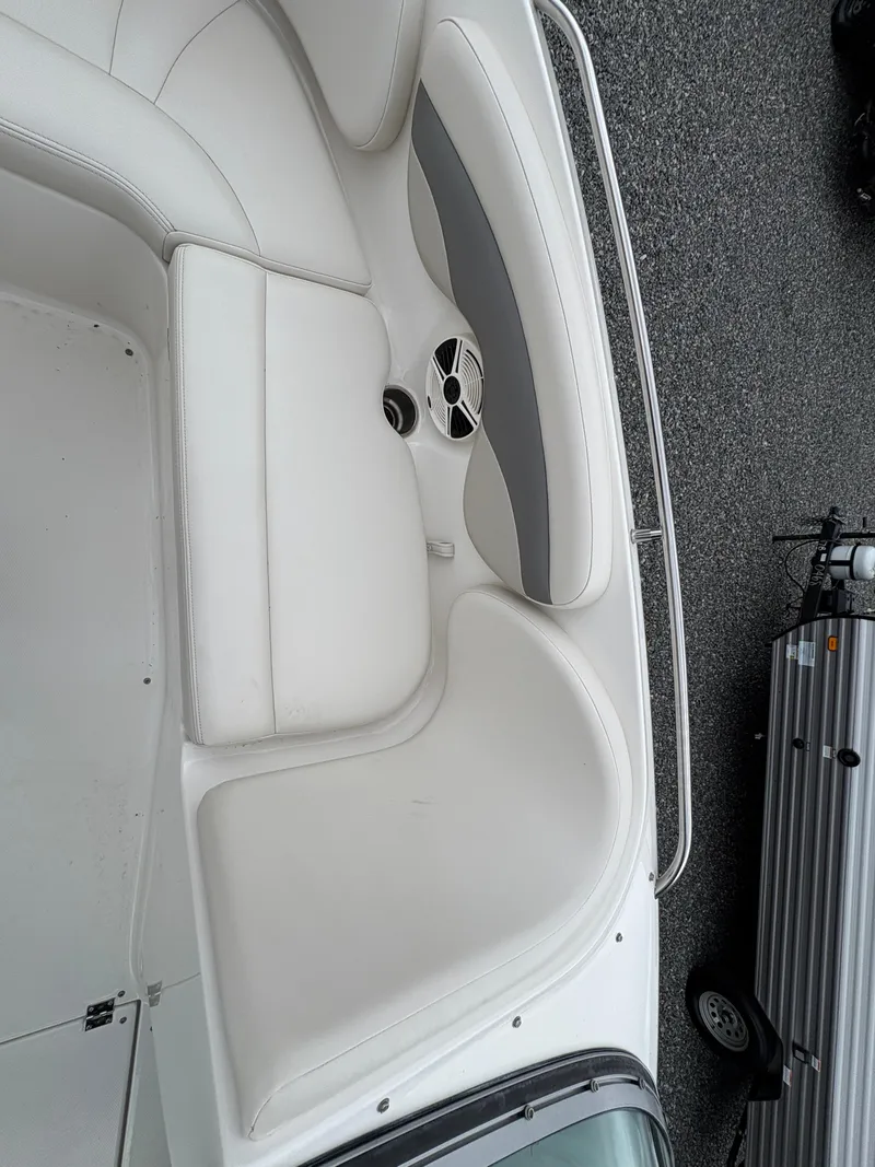 Slide: The Image of 2009 Chaparral 210 SSi boat interior with white seating and gray accents. - 21
