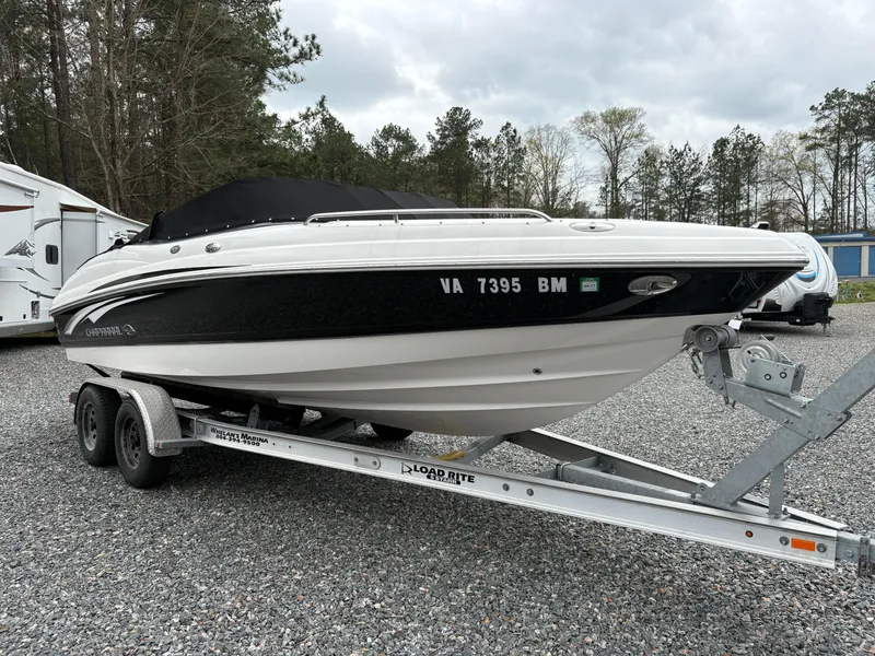 Slide: The Image of 2009 Chaparral 210 SSi boat on trailer, parked outdoors on gravel. - 4