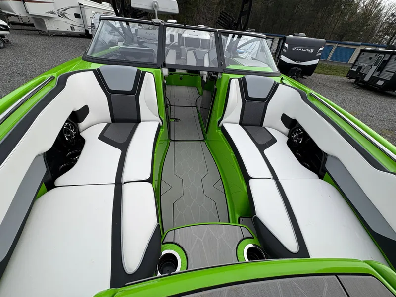 Slide: The Image of 2022 Yamaha Boats 255XD with sleek green and white interior design. - 24