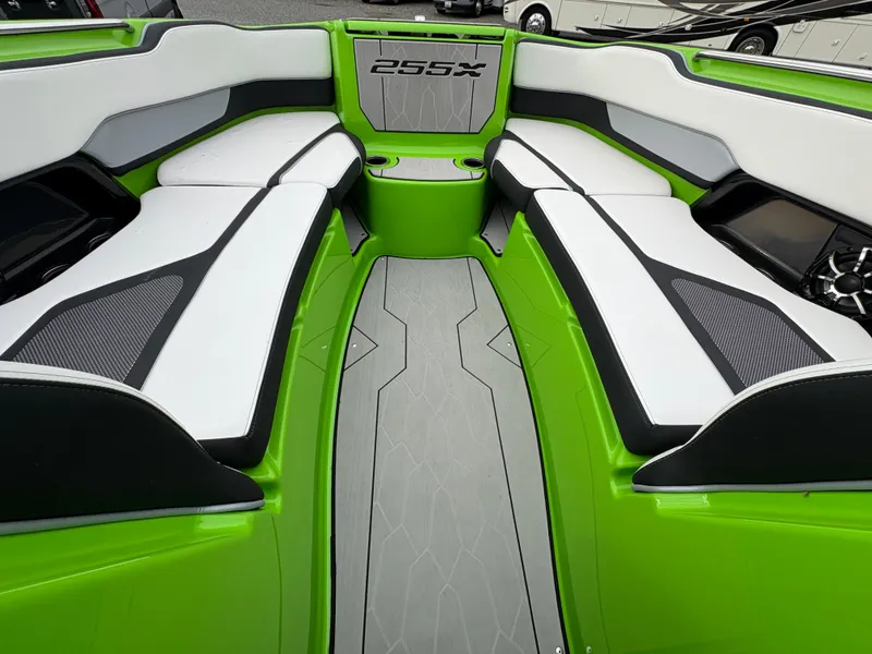 Slide: The Image of 2022 Yamaha Boats 255XD interior with green and white seating, modern design. - 25