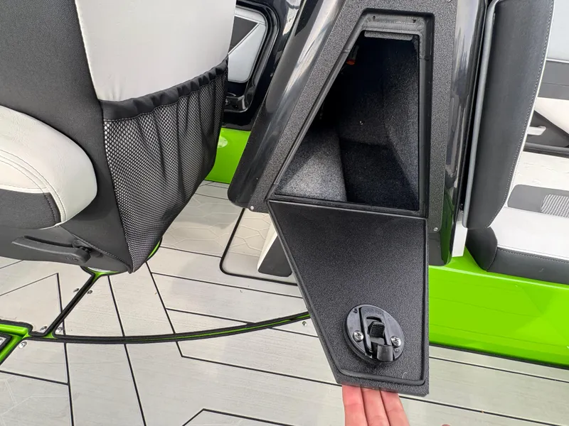 Slide: The Image of 2022 Yamaha Boats 255XD interior storage compartment with sleek design and modern features. - 32