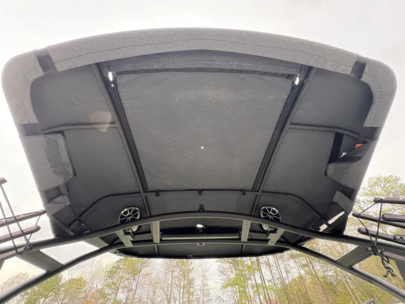 Slide: The Image of 2022 Yamaha Boats 255XD canopy view, showcasing sleek design and integrated speakers. - 33