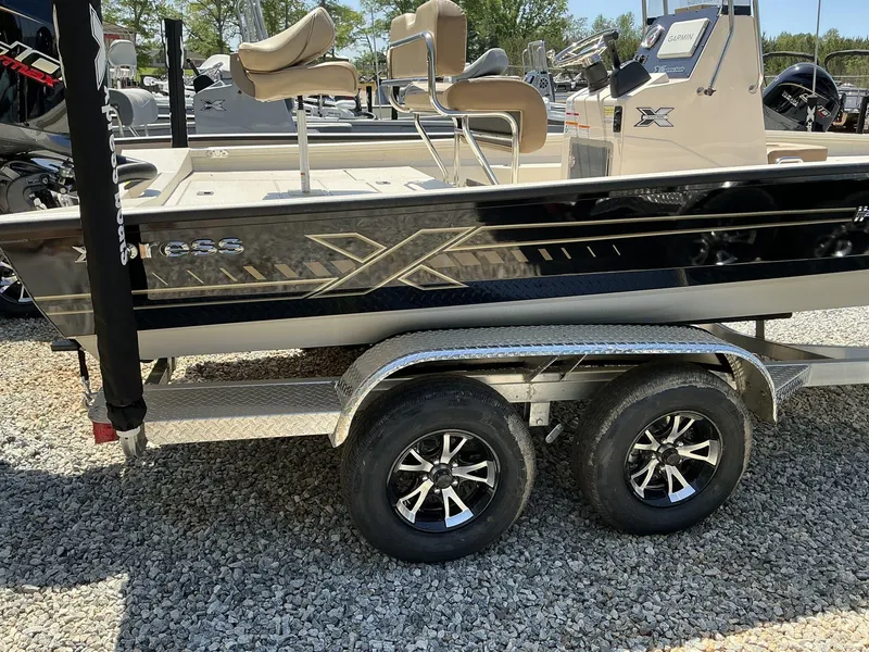 Slide: The Image of 2025 Xpress Hyper-Lift Series H22B boat on trailer, featuring Terrova motor. - 10