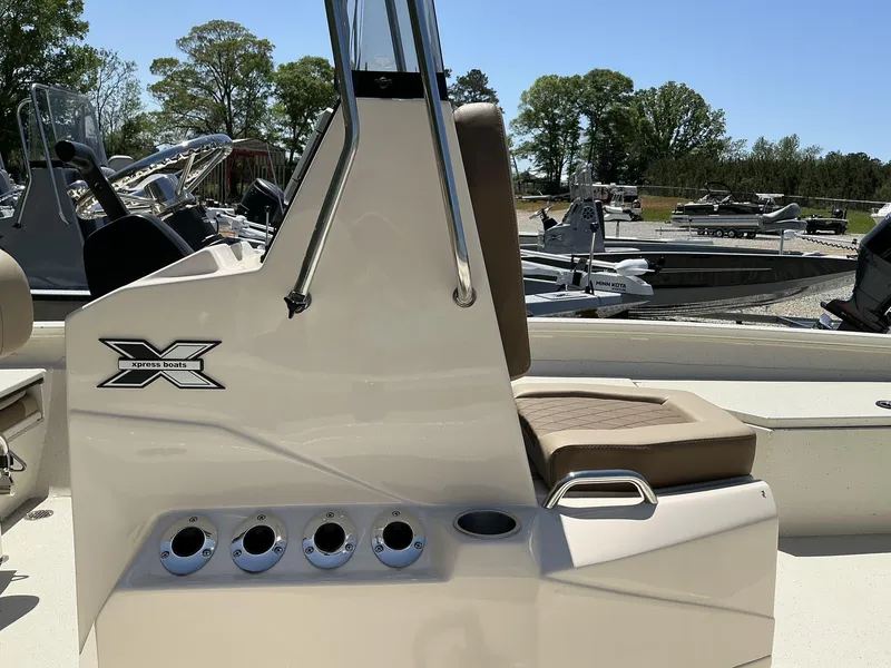 Slide: The Image of 2025 Xpress Hyper-Lift Series H22B boat with Terrova, featuring sleek design and seating. - 4