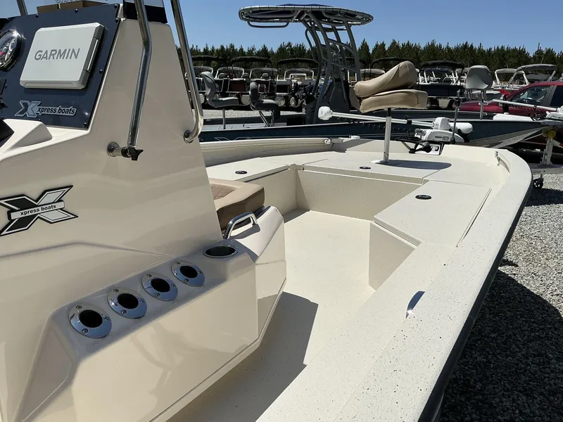 Slide: The Image of 2025 Xpress Hyper-Lift Series H22B boat with Garmin system, docked outdoors. - 6