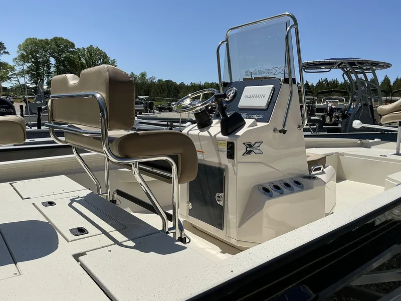 Slide: The Image of 2025 Xpress Hyper-Lift Series H22B boat interior with Garmin system and seating. - 8