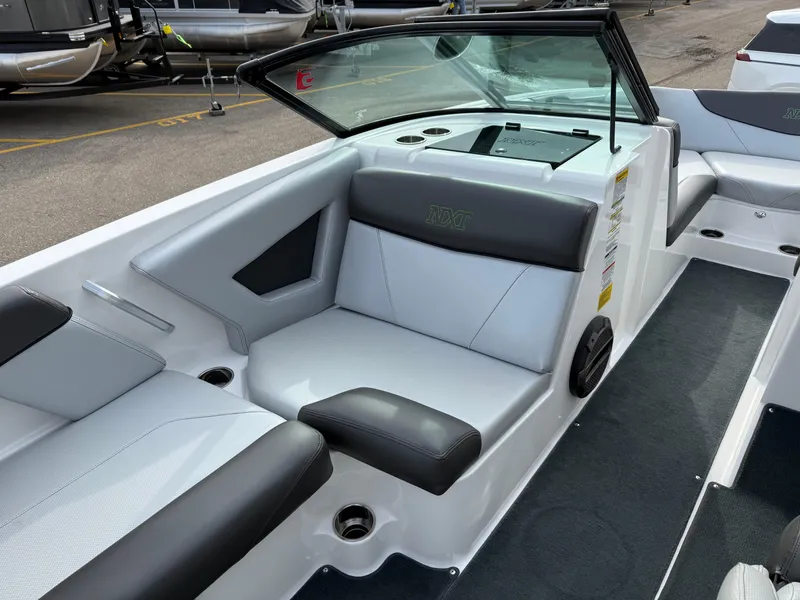 Slide: The Image of 2019 MasterCraft NXT22 boat interior with sleek seating and modern design. - 12