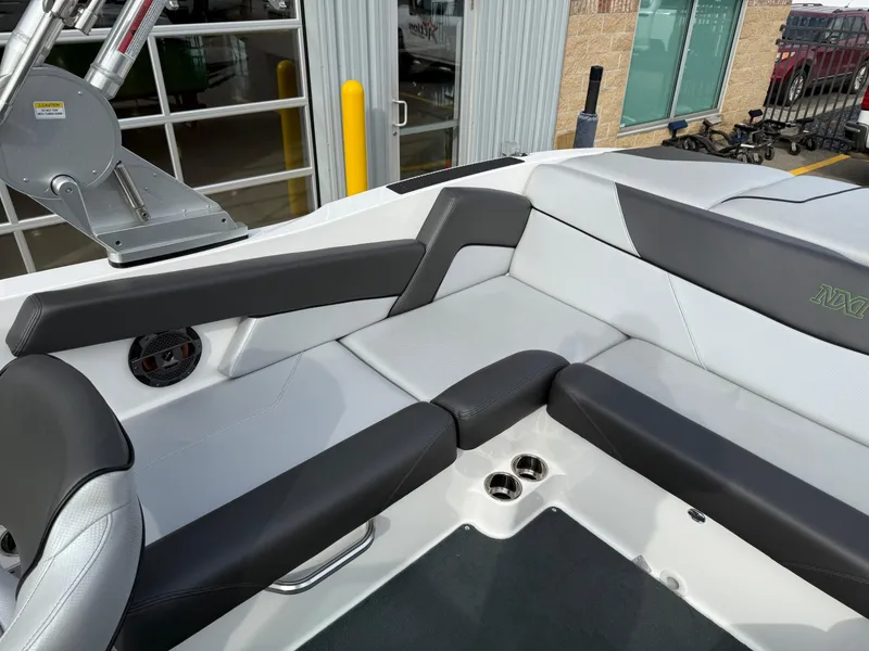 Slide: The Image of 2019 MasterCraft NXT22 boat interior with sleek black and white seating. - 8