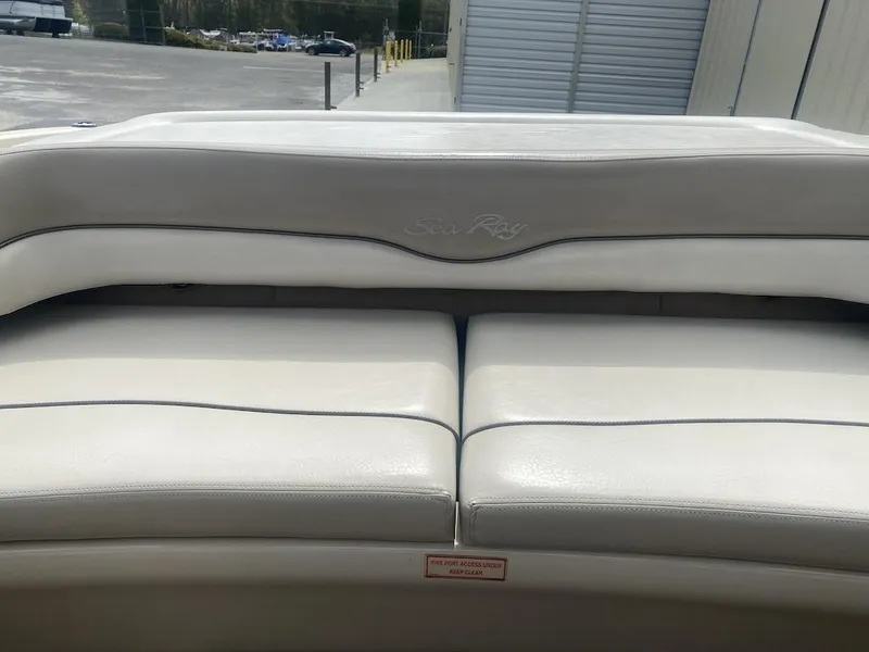 Slide: The Image of 2003 Sea Ray 182 SRX Bow Rider boat interior with white leather seating. - 18