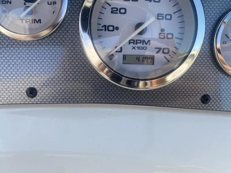 Slide: The Image of Close-up of 2003 Sea Ray 182 SRX Bow Rider dashboard gauges showing RPM and trim. - 20
