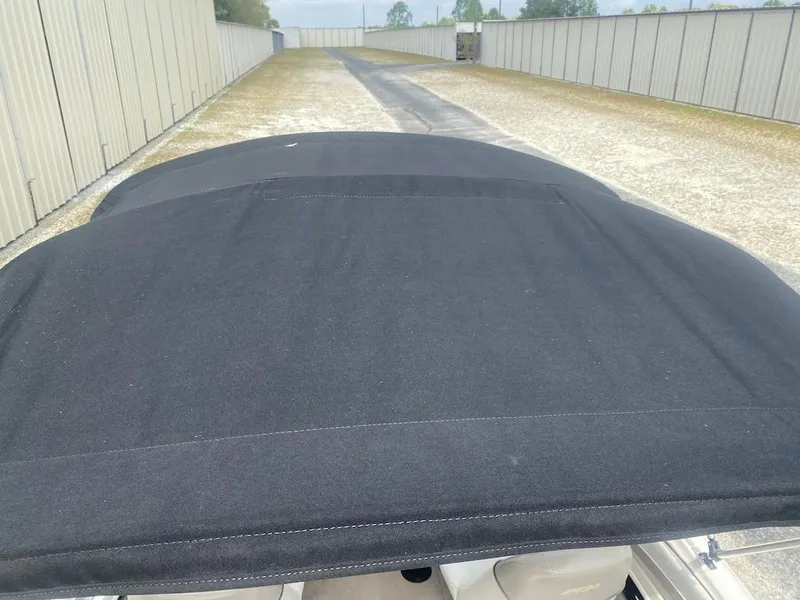 Slide: The Image of 2003 Sea Ray 182 SRX Bow Rider with black cover in storage area. - 21