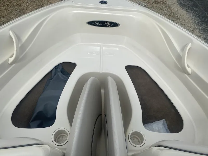 Slide: The Image of 2003 Sea Ray 182 SRX Bow Rider interior, featuring seating and storage compartments. - 8