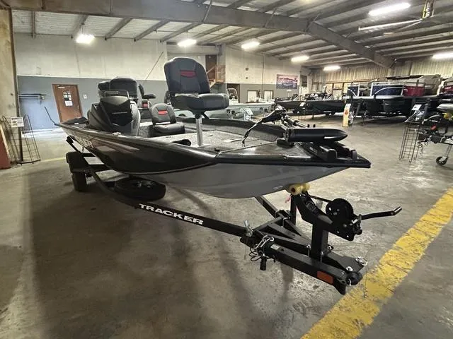 Slide: The Image of 2025 Tracker PT175TF boat in showroom, featuring sleek design and modern equipment. - 10