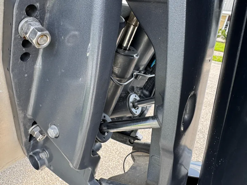 Slide: The Image of Close-up of 2016 Wellcraft 241 boat engine components, showcasing mechanical details and structure. - 11