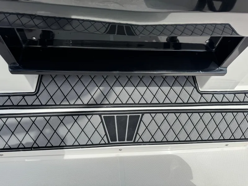 Slide: The Image of Deck detail of 2016 Wellcraft 241 boat with diamond-patterned flooring. - 34