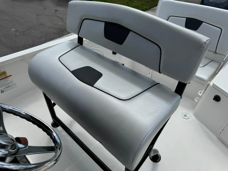Slide: The Image of 2016 Wellcraft 241 boat seat with sleek gray upholstery and black accents. - 35