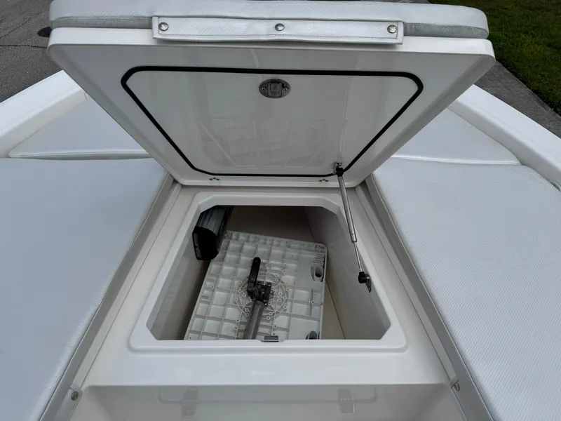 Slide: The Image of Open storage compartment on 2016 Wellcraft 241 boat, showing interior details. - 40
