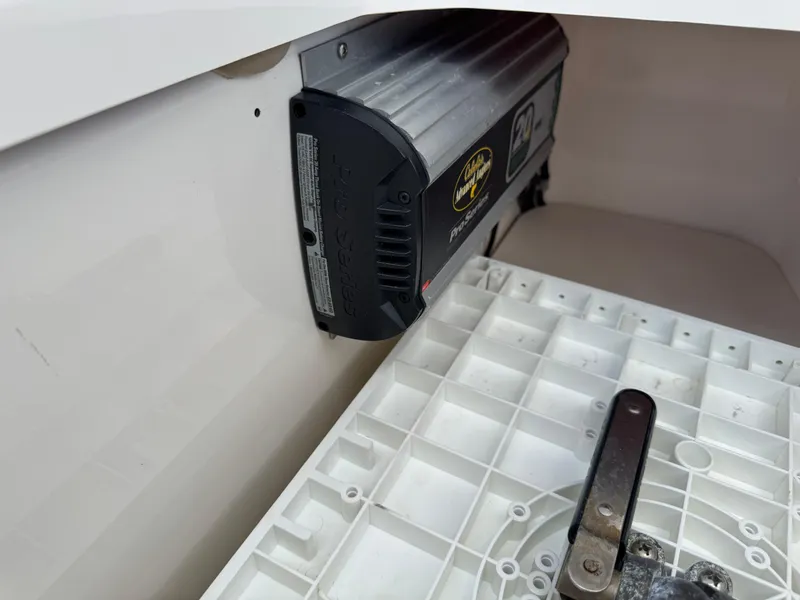 Slide: The Image of Battery charger installed in a 2016 Wellcraft 241 boat compartment. - 41